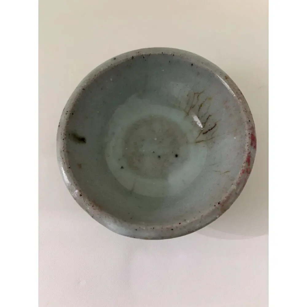 pottery bowl with clear crystal sphere and yellow cats eye heart gemstone